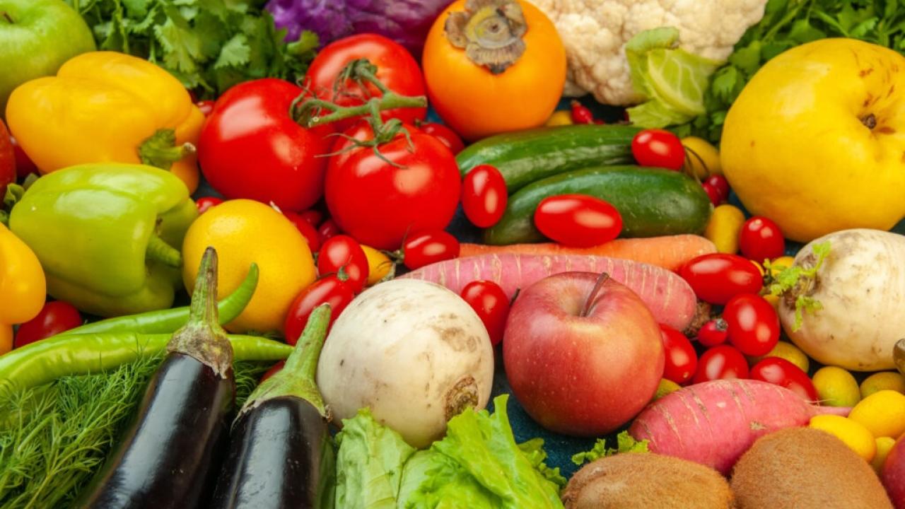 Tabletop with fruits and vegetables.