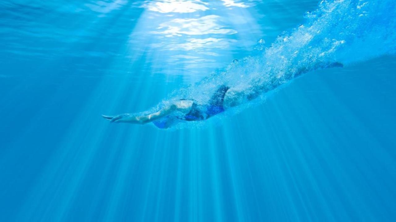 Person diving into water