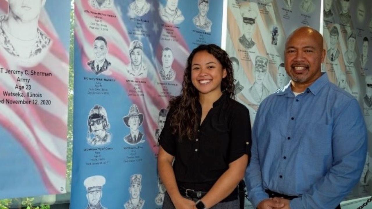 Father and daughter standing together