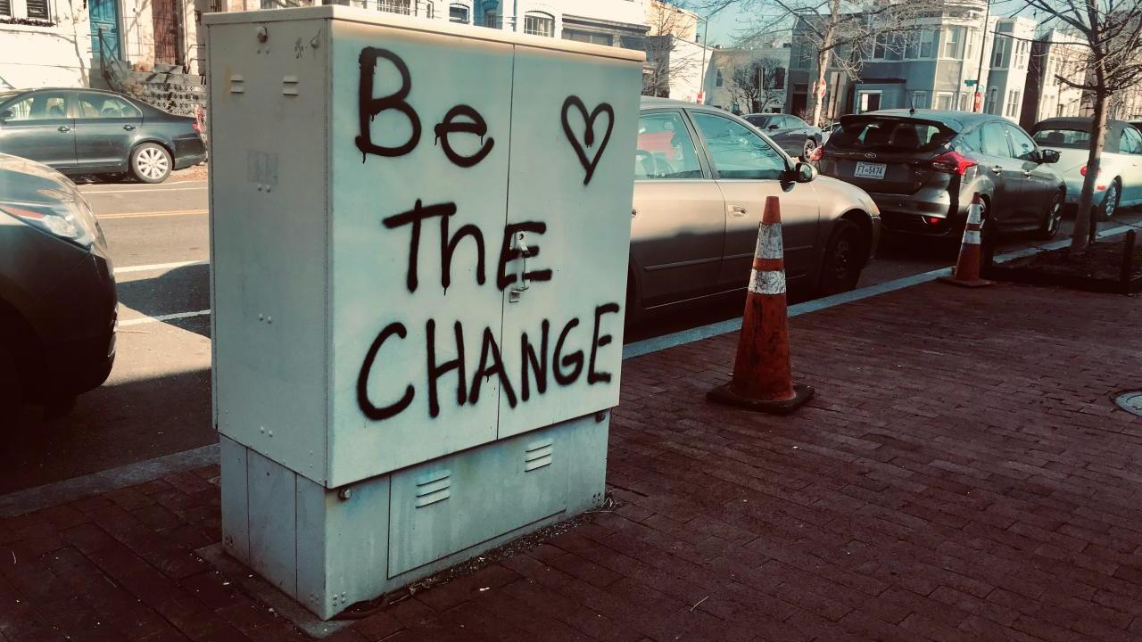 "Be the change" spray painted outside