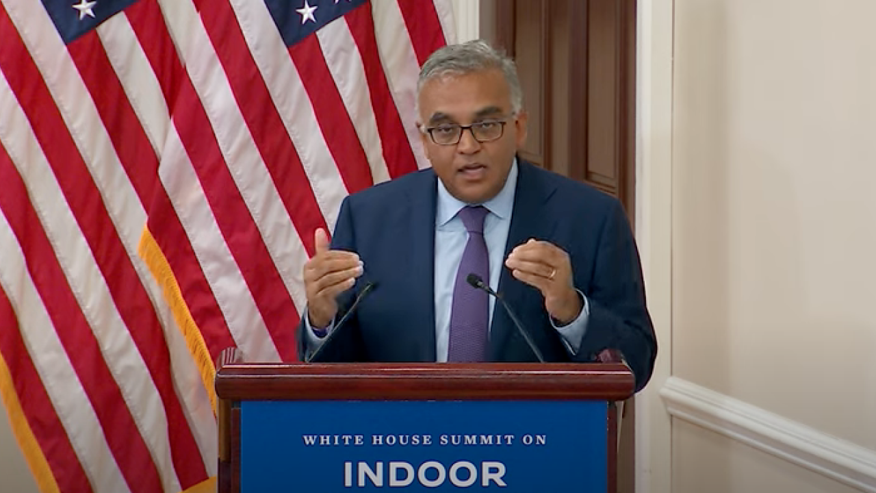 Dr. Jha at podium