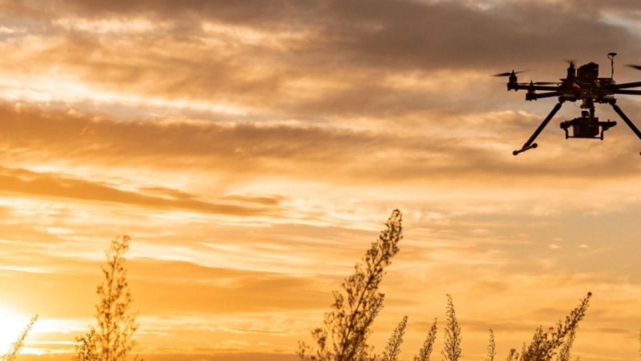 drone in the sky at sunset