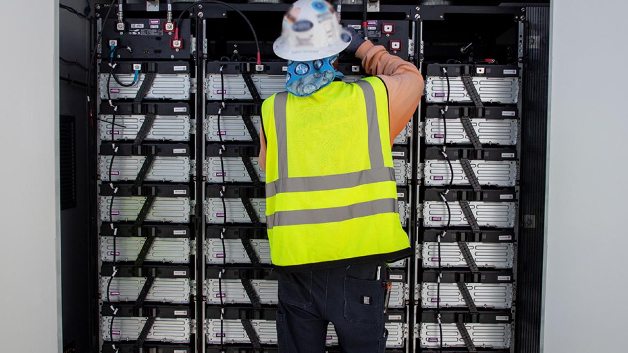 person working on electrical equipment