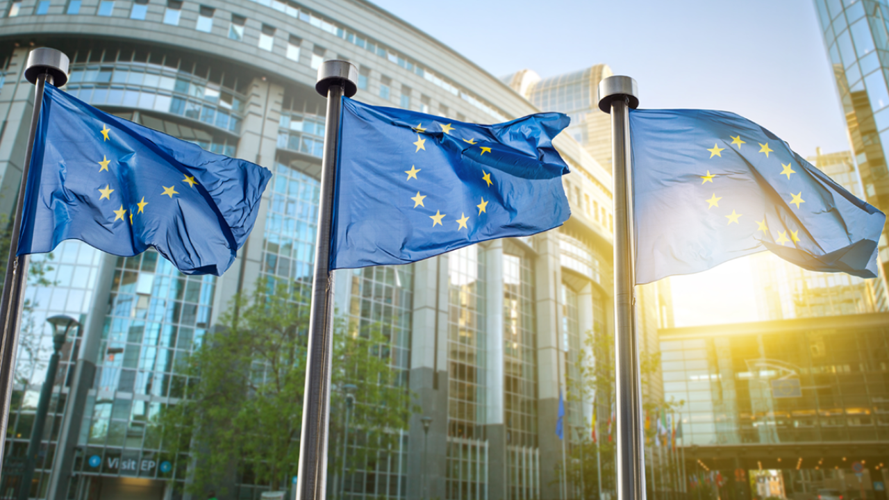 Three EU flags waving in the wind