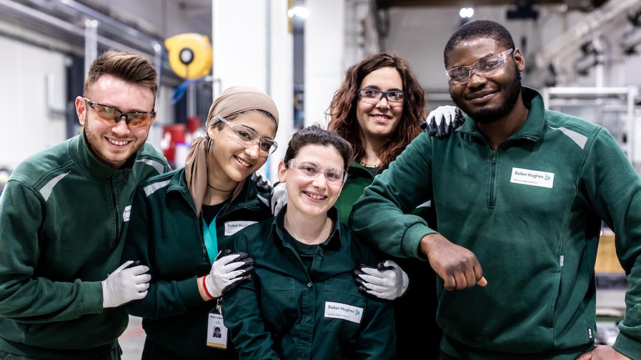 group of Baker Hughes employees posing together
