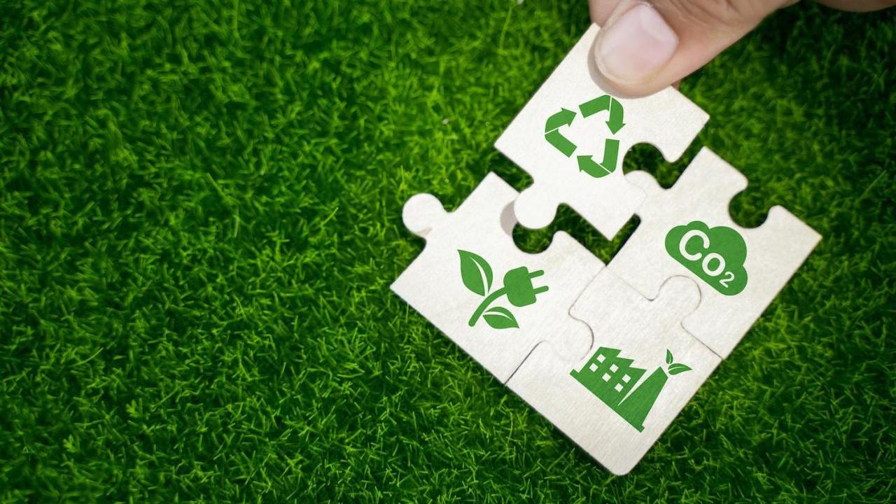 puzzle pieces representing ESG and sustainability - recycling reducing emissions