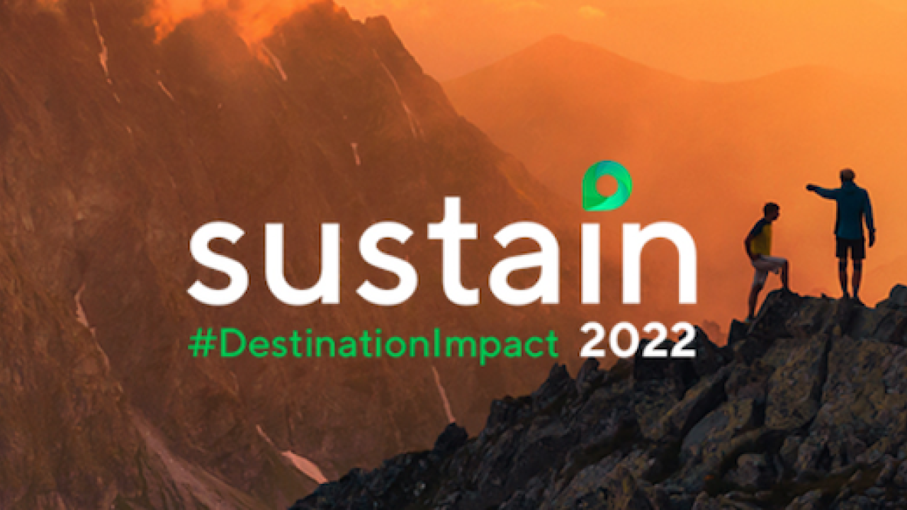 Sustain #DestinationImpact 2022. Three climbers on a mountain top at sunset.