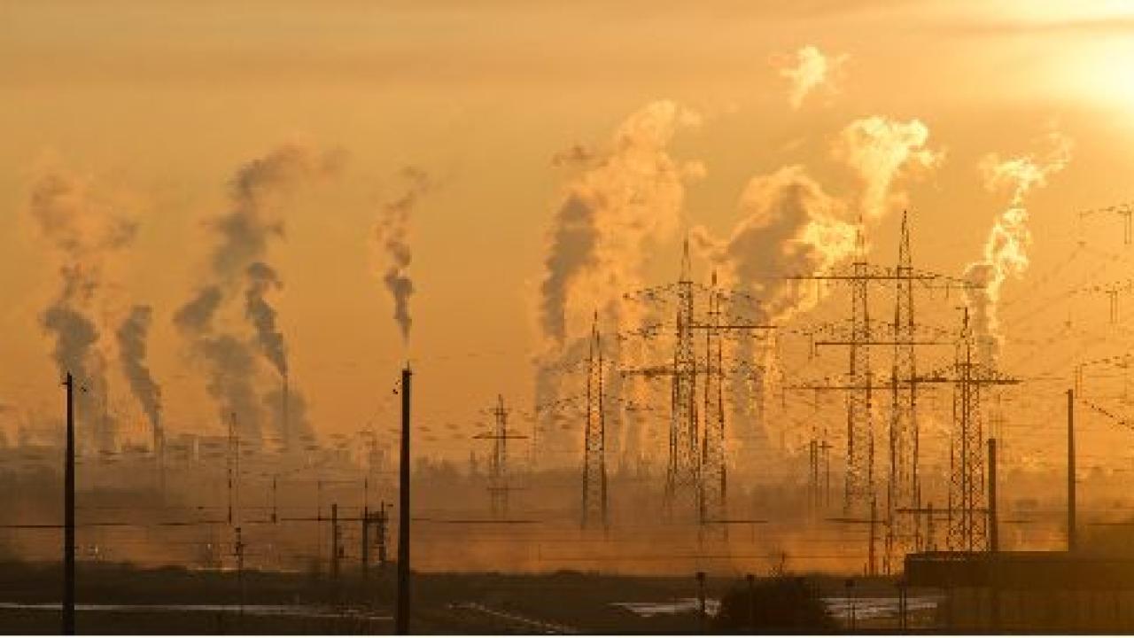 Factories spitting pollution into the sky.