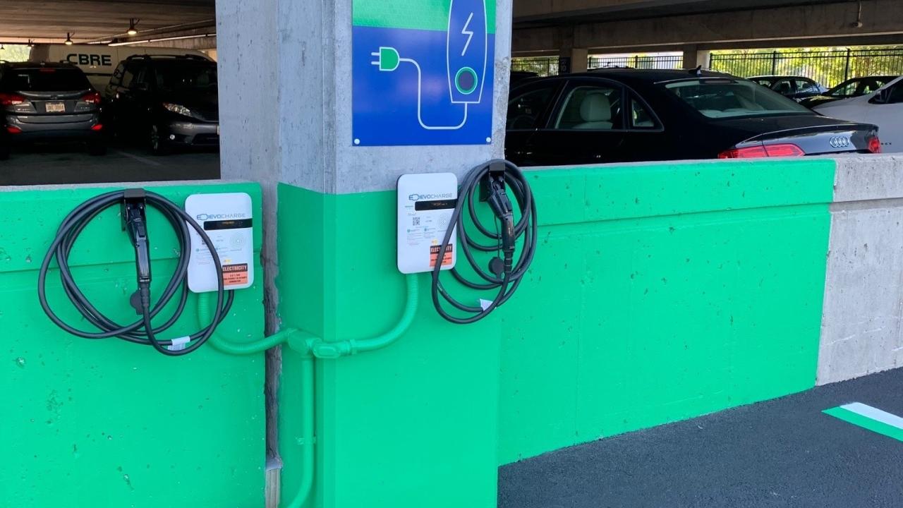 Electric vehicle charging station in a parking garage
