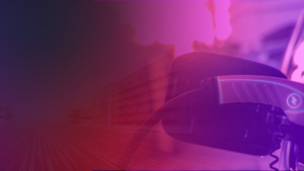 An electric vehicle plugged in, a purple and red tint over the top of the image.