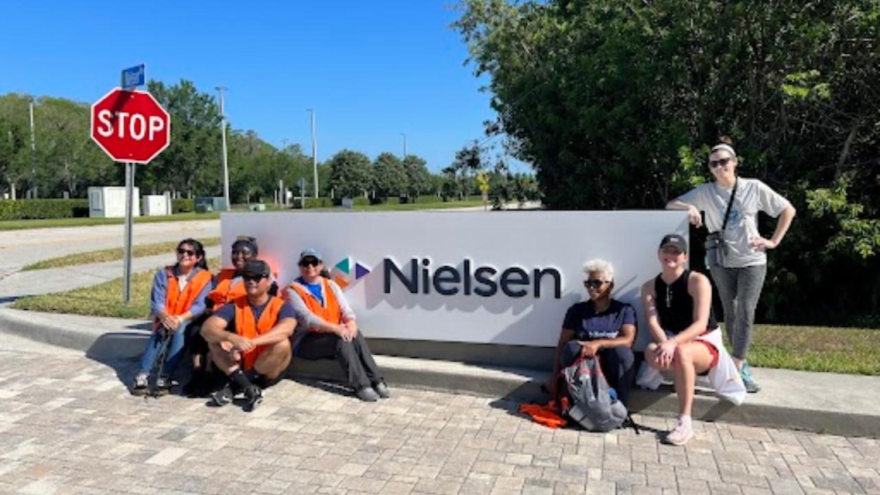 Nielsen Team Members in front of the corporate headquarters.
