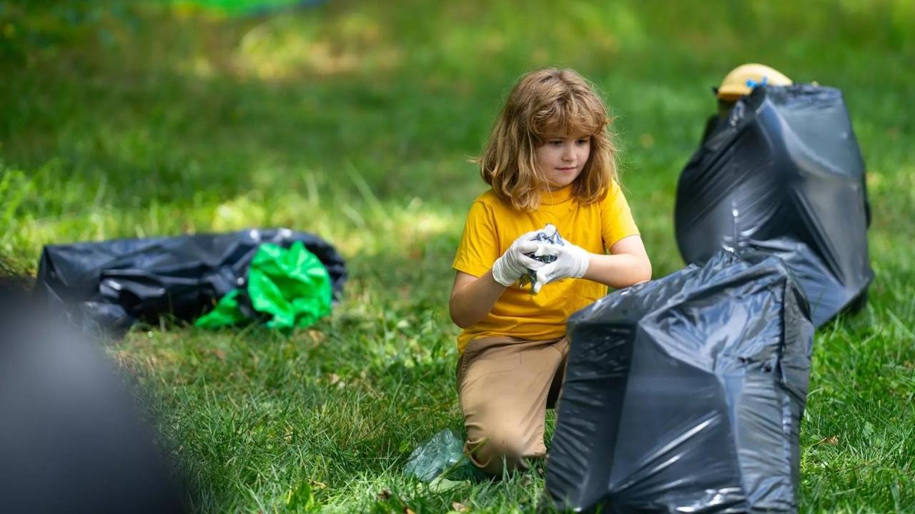 Child picking up litter