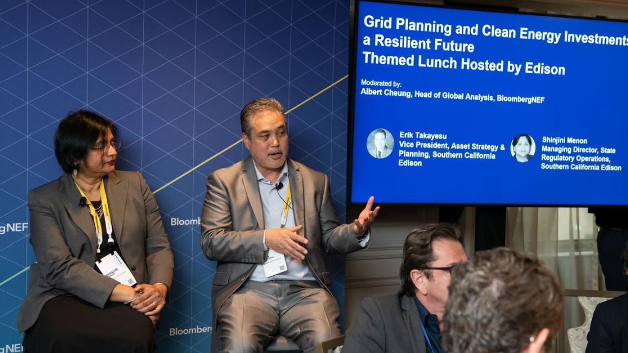 SCE executives Erik Takayesu (speaking) and Shinjini Menon explained the company's plans for transitioning to carbon-free energy sources at the BloombergNEF Summit in New York.