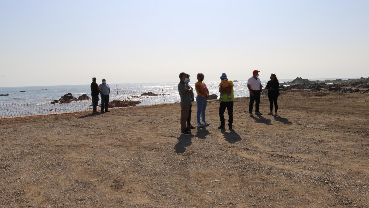 people standing on a beach