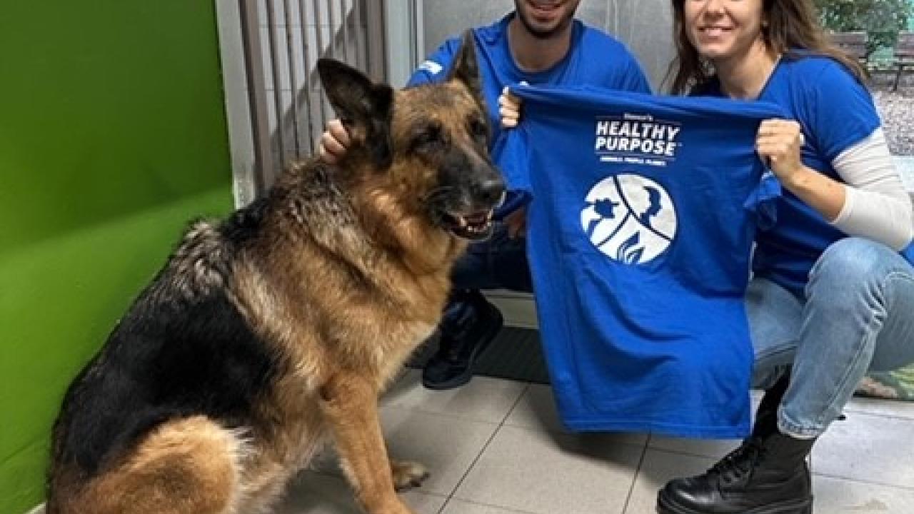 Elanco employees with dog 