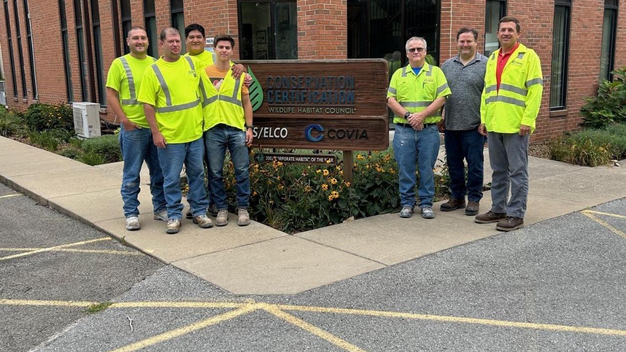 Workers standing outside of Elco Covia plant