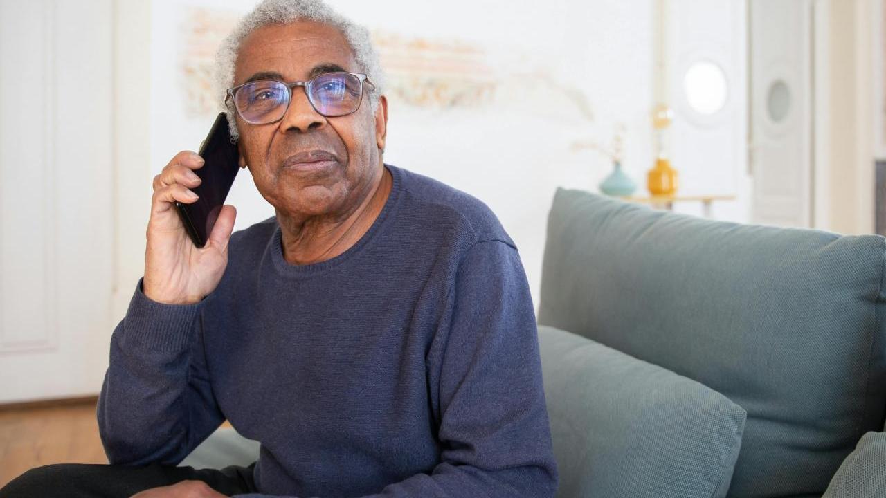 Older gentleman on the phone.