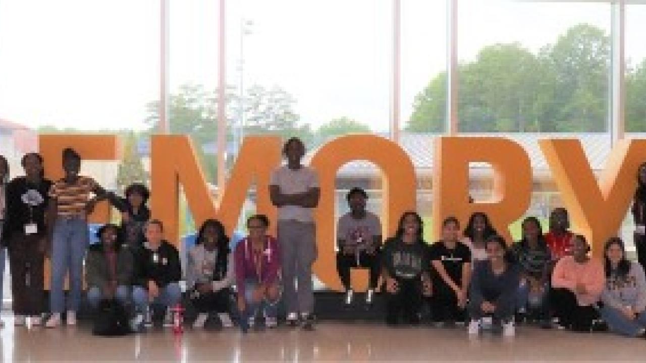 Group together in front of EMORY letters in window