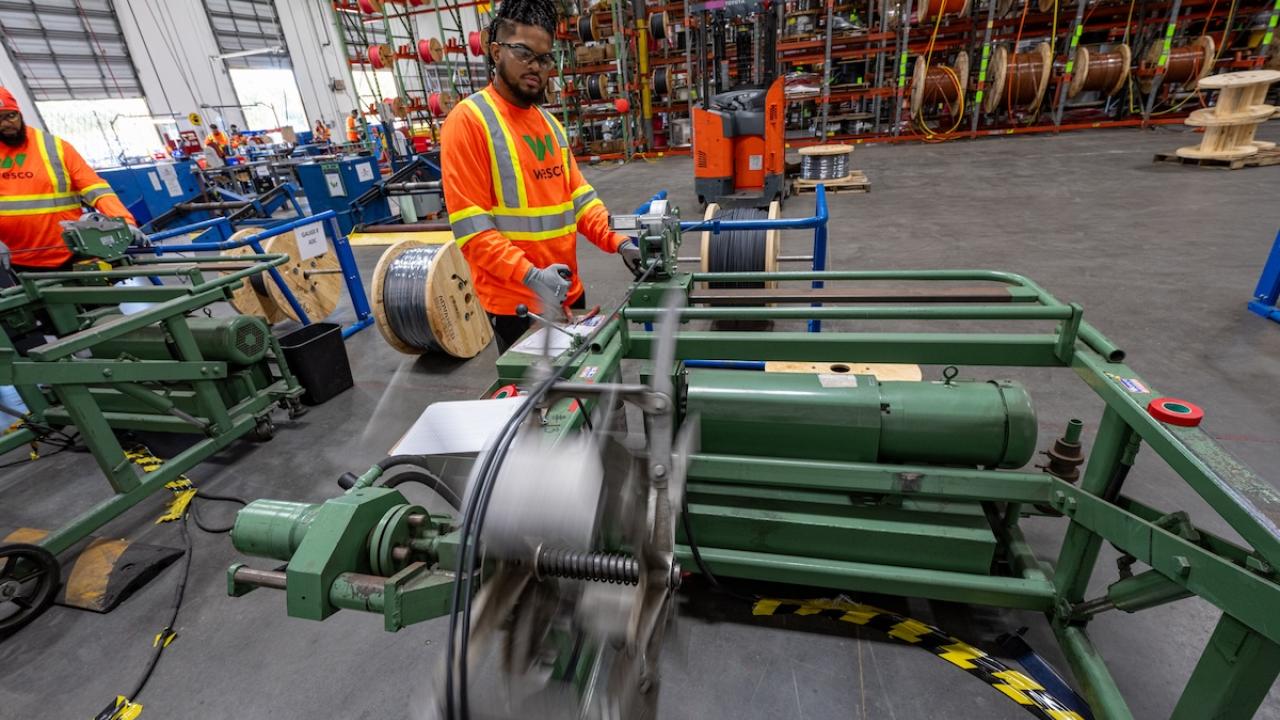 Wesco employee cutting spool wire.