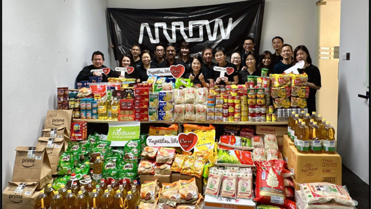 Arrow employees helping at a food bank in Singapore