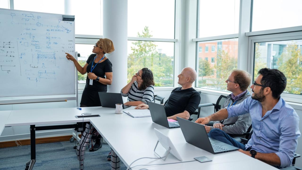 Qualcomm employees in a conference room