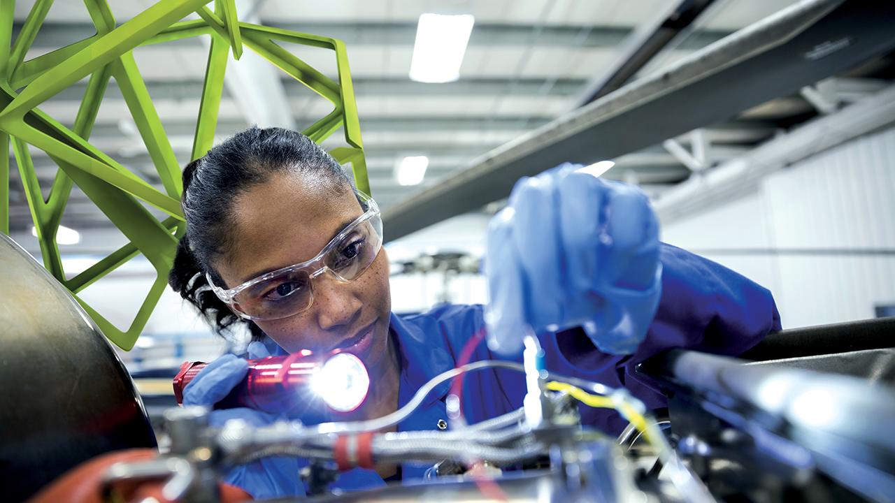 MilliporeSigma employee inspecting wires