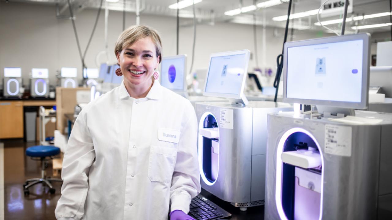 Illumina Associate Director of Scientific Research Erin Imsand with the new MiSeq i100 System. Photo by Kristy Walker.