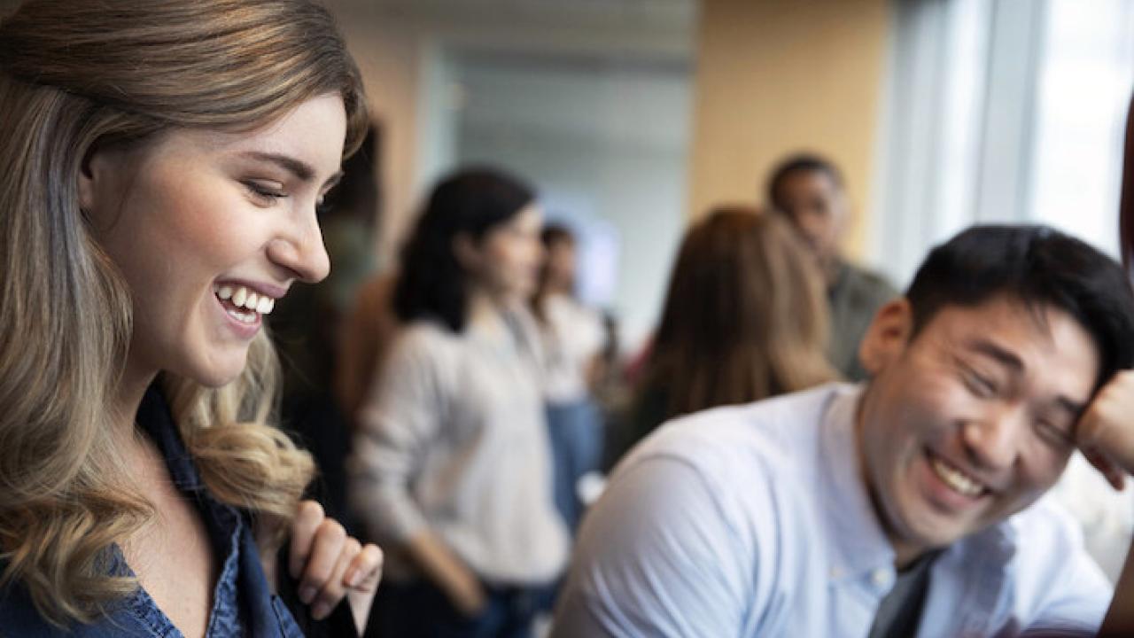 Two Essity employees shown having a conversation.
