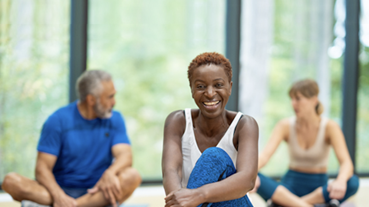 People sat on exercise mats