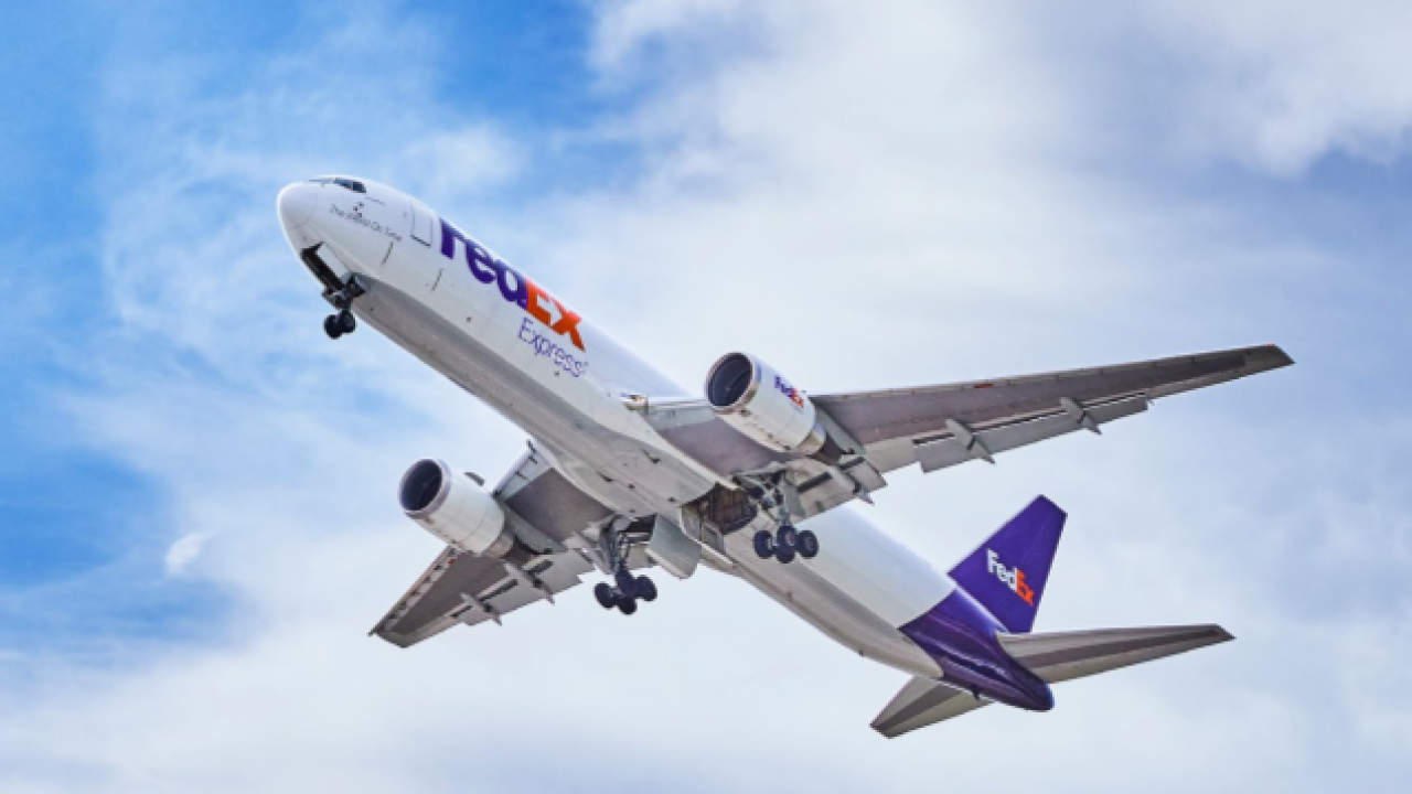 a FedEx Express airplane in the sky