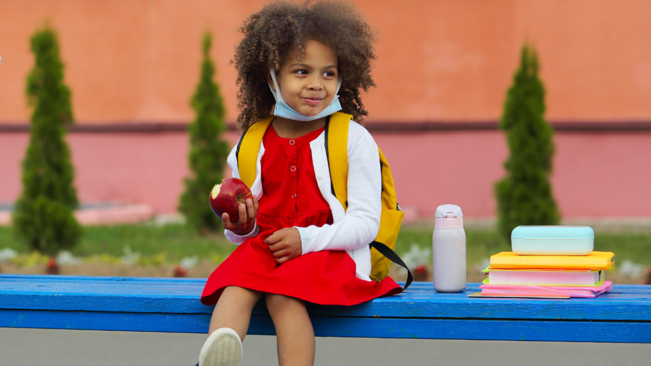 child sitting on a bench