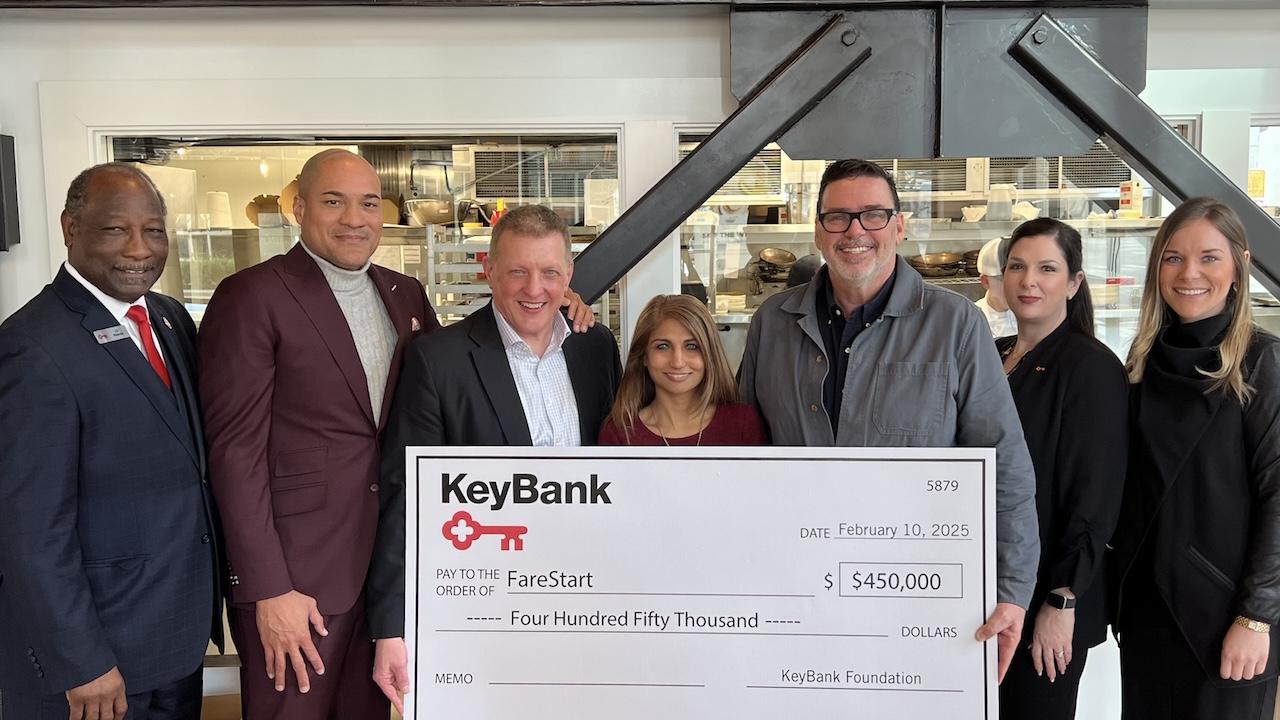 FareStart and KeyBank Team Members shown with a $450,000 grant check.