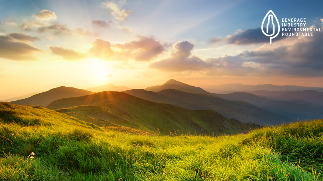 Sunrise over hills with BIER logo in top right corner