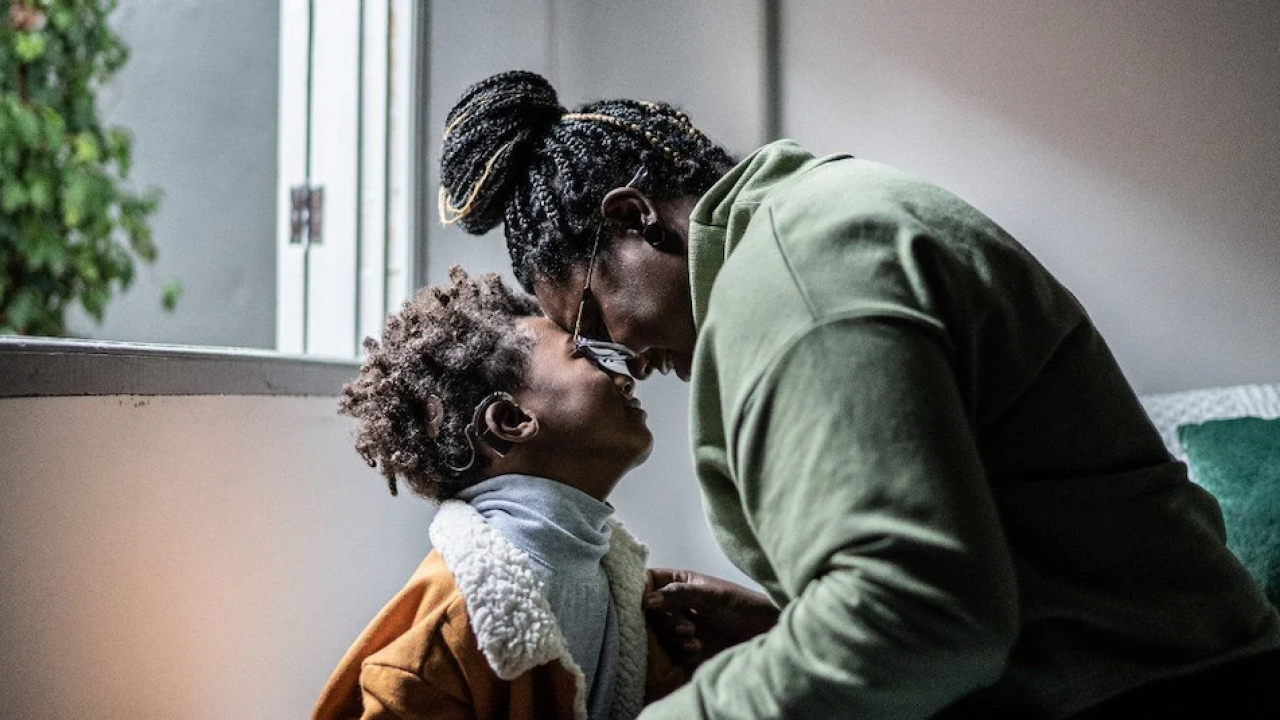 A couple embracing.