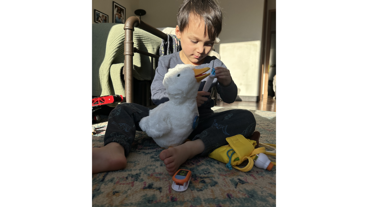 Arlo holding his feathered friend