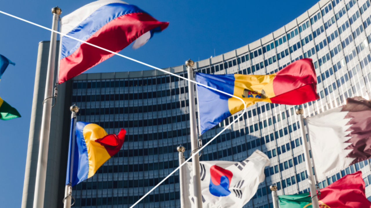 Different flags in front of a building 