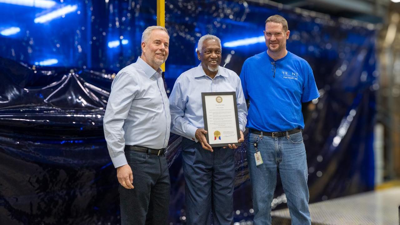 Ray Pittard, Trane Technologies Executive Vice President and Chief Officer, Integrated Supply Chain; Fort Smith Mayor George McGill and Carter Roth, Trane Fort Smith Plant Manager hold a proclamation declaring today (February 21) Trane Fort Smith Day