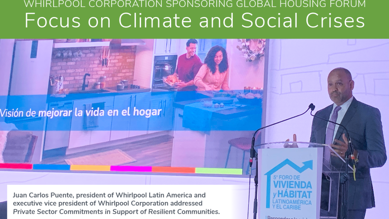 A person at a podium. "Whirlpool corporation sponsoring global housing forum Focus on Climate and Social Crises." 