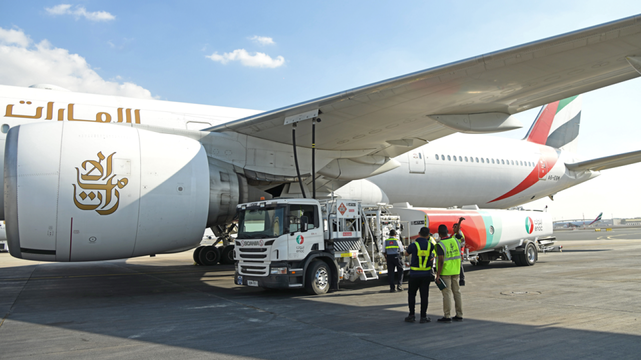 people standing next to airplane 