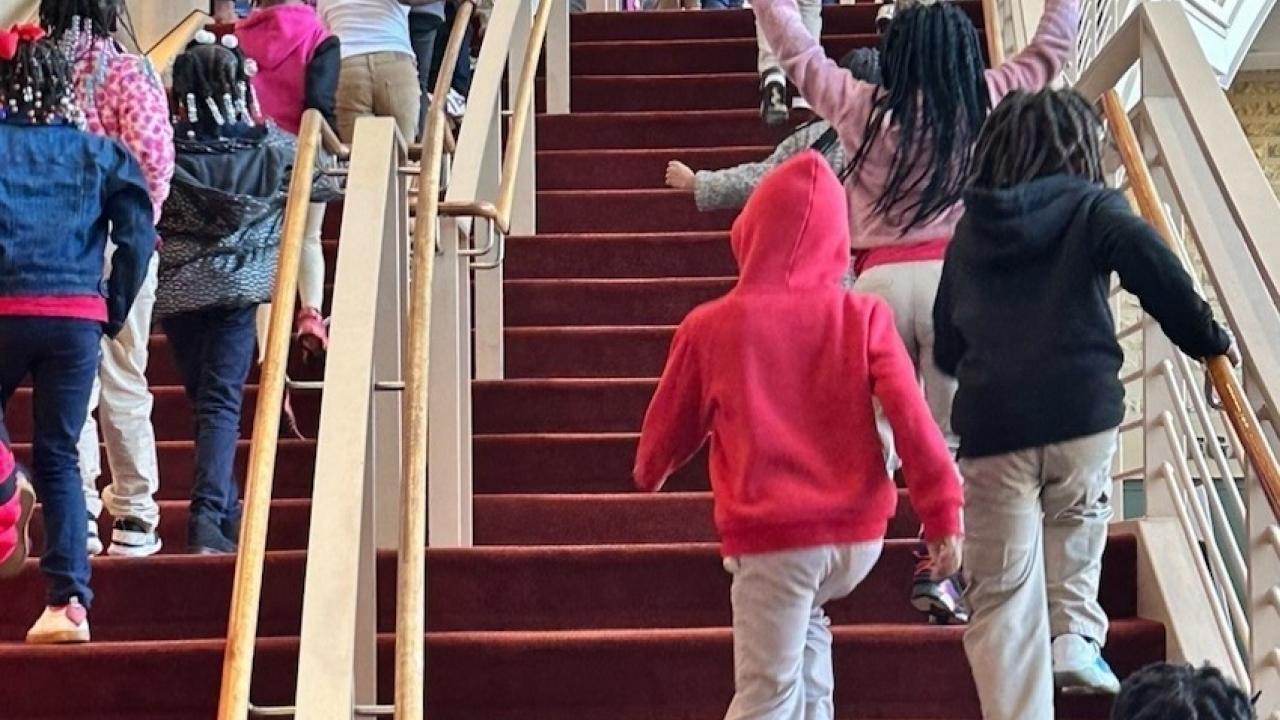 Students from MLK Elementary School shown going to see the musical.