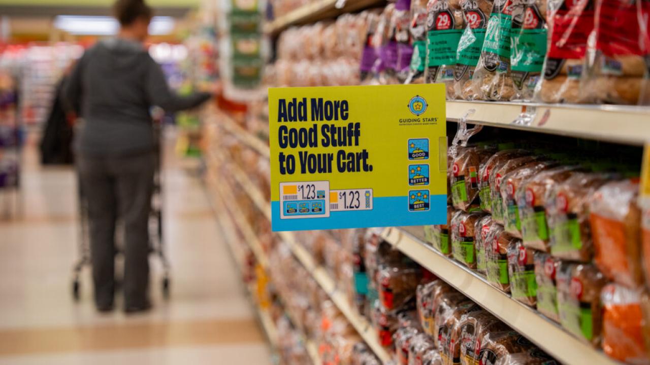 Grocery store aisle with a Guiding Stars sign on a shelf.