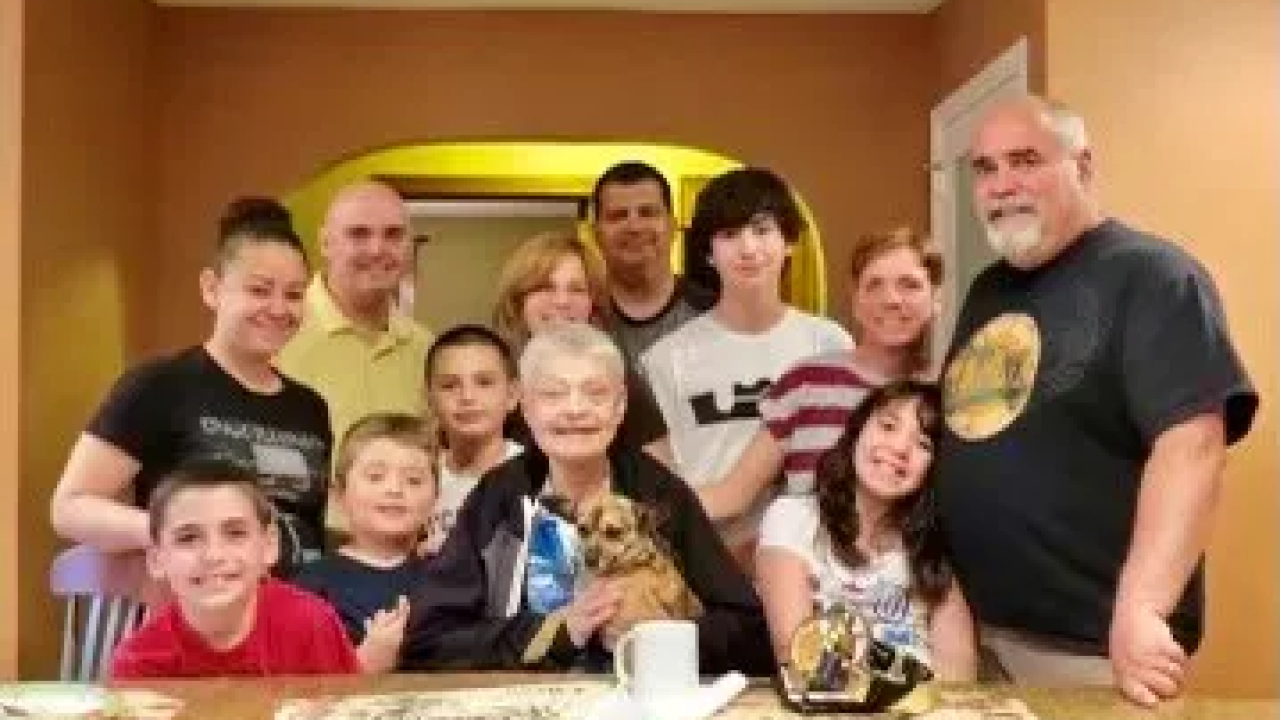 Gerri Kuo surrounded by family