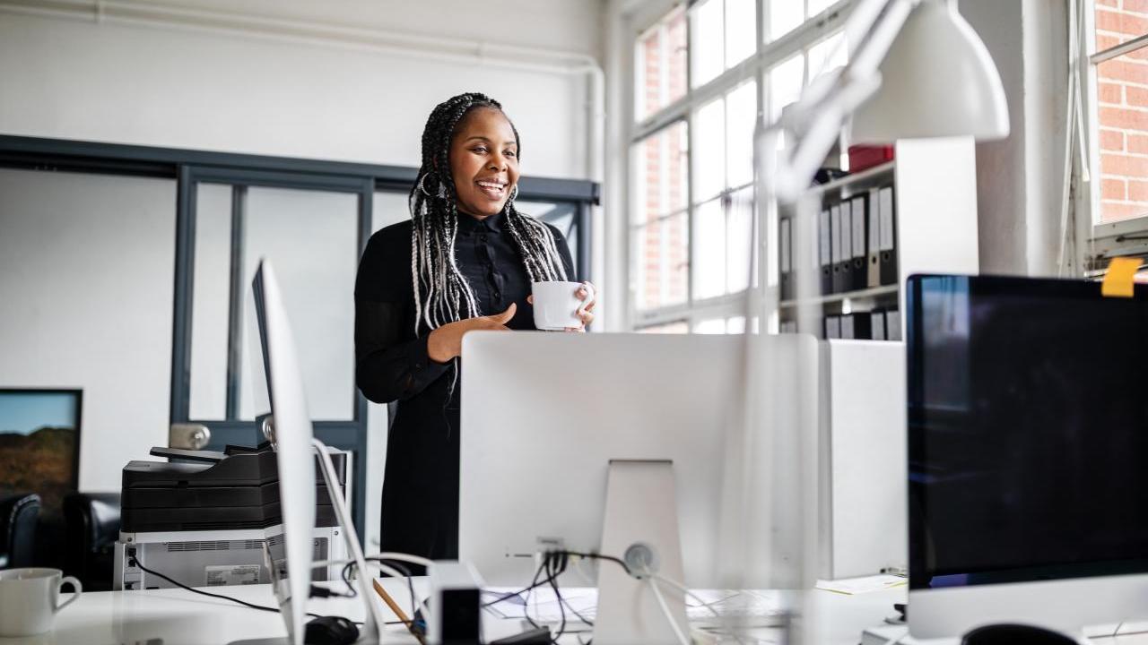 Person working at desk with computer