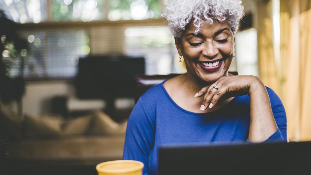 Women looking down at laptop
