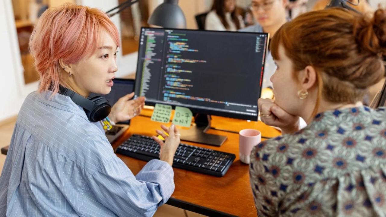 two women discussing cybersecurity