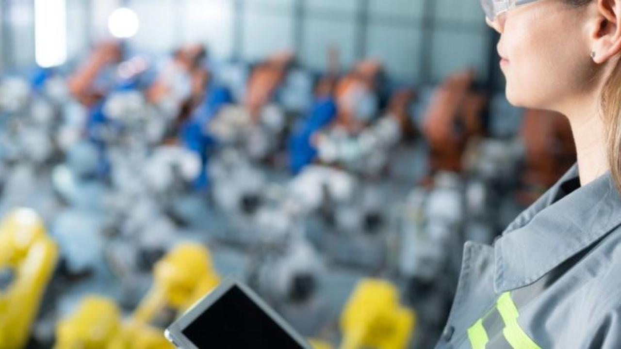 Engineer looks over machinery
