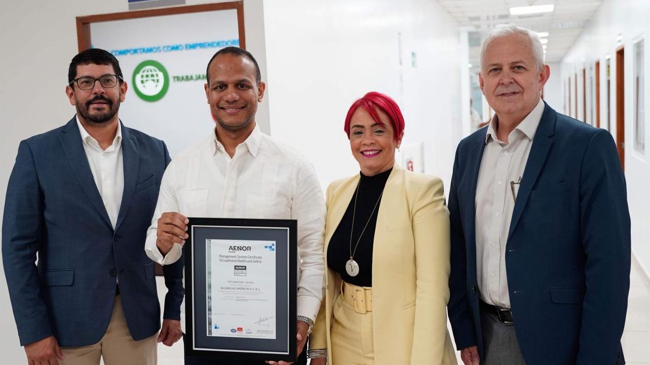 Four Gildan representative holding Gildan's first ISO 45001 Certification