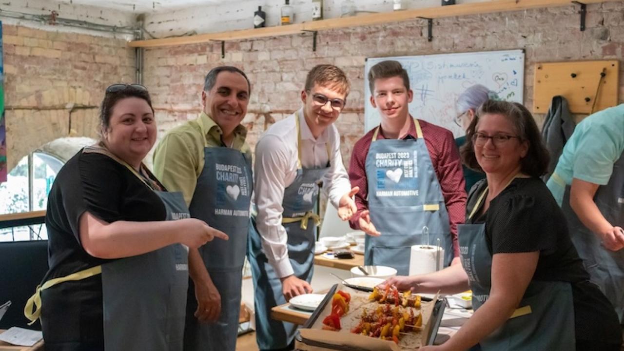HARMAN volunteers shown preparing meals for the homeless.
