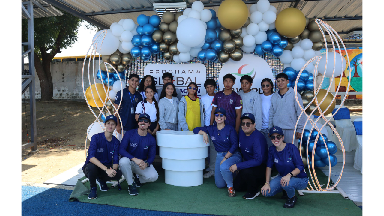 Group of children in front of a balloon arch