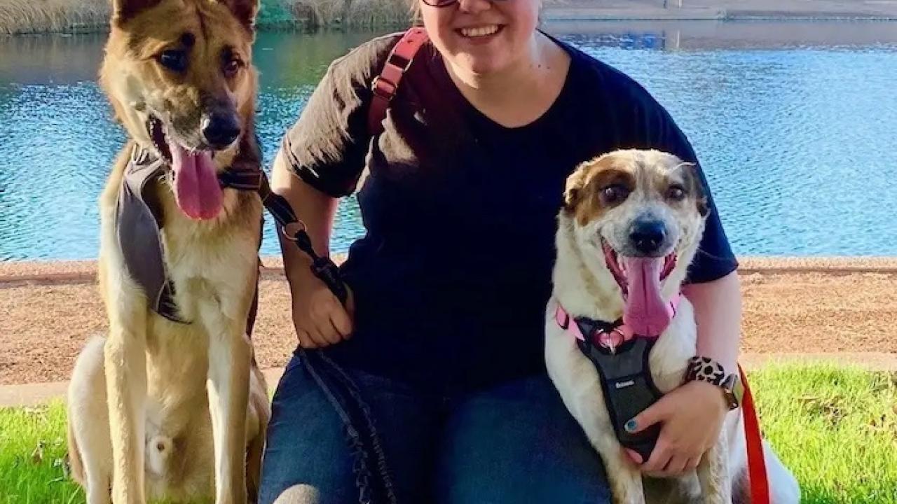 Tayler Chambers shown with her two dogs.